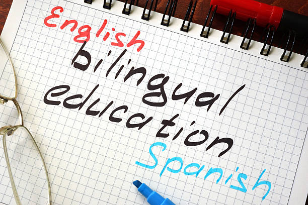 Sign bilingual education written in a notepad on a table.