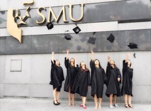 Throwing the mortarboard with a group of friends – after going through the grinding 4 years together!